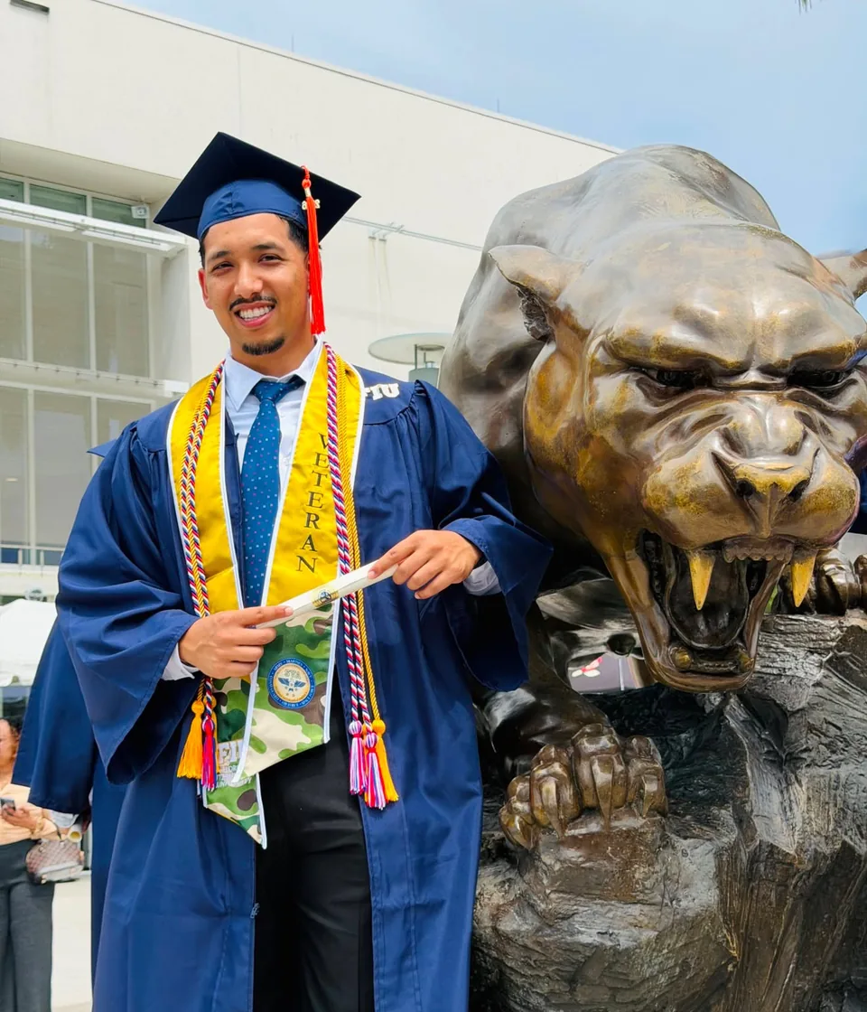 Tj, veteran and founder of Infinite Solutions JAX, in his FIU graduation gown
